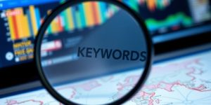 Magnifying glass on a digital map focusing on keywords.