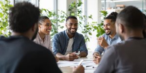 Diverse employees collaborating and discussing in a bright office.