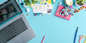 Vibrant workspace with laptop and product samples.