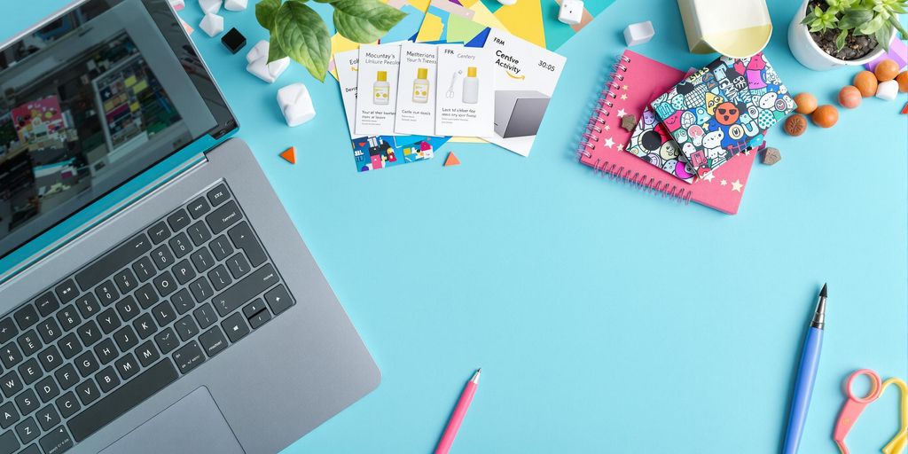 Vibrant workspace with laptop and product samples.