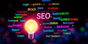 Light bulb with colorful digital keyword tags for SEO.