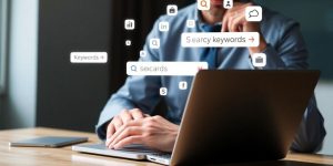 Digital marketing keywords analysis on a laptop screen.