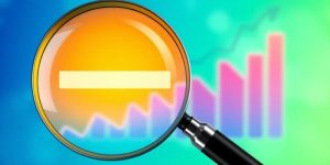 Magnifying glass and graph representing keyword search in SEO.