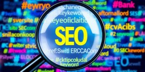 Collage of magnifying glass and colorful keywords for SEO.