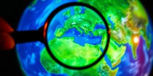 Magnifying glass over a globe