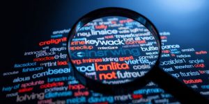 Magnifying glass over keywords, bright, clear.