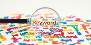 Magnifying glass over a diverse keyword collection.